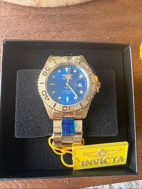 Invicta Gold Tone Watch with Blue Dial and Bracelet Accents